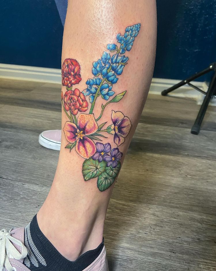 Image of a flower tattoo on left calf